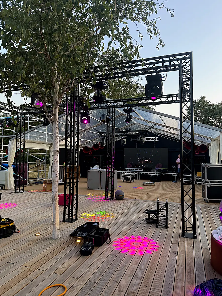 Truss rig with moving heads over garden decking